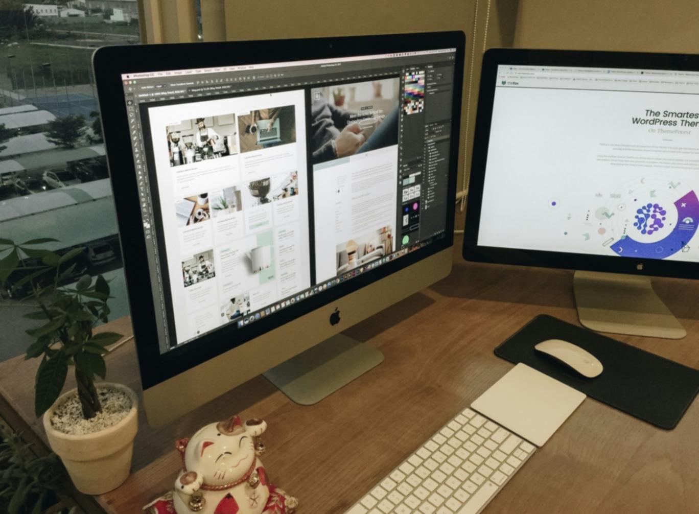 Game development team collaboration workspace with multiple screens showing game prototypes